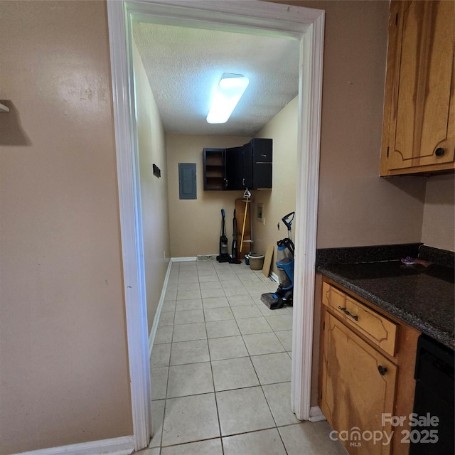 6573 Weldon Cir NW Unit 22, Concord, NC 28027 - hall with light tile patterned flooring, a textured ceiling, baseboards, and electric panel