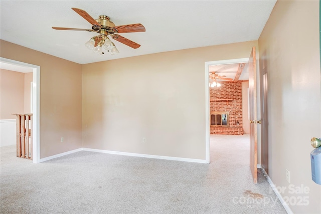 6573 Weldon Cir NW Unit 22, Concord, NC 28027 - unfurnished room with a ceiling fan, carpet, and a fireplace