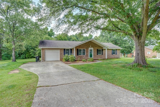 6573 Weldon Cir NW Unit 22, Concord, NC 28027 - ranch-style home featuring a garage, brick siding, driveway, and a front yard