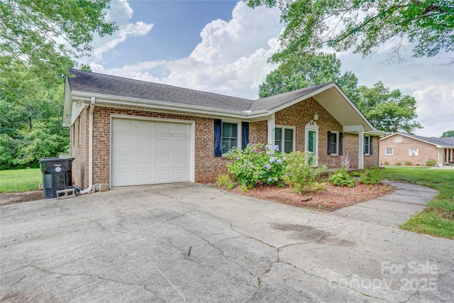 6573 Weldon Cir NW Unit 22, Concord, NC 28027 - single story home featuring brick siding, a garage, asphalt driveway, and a shingled roof