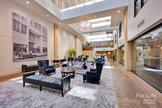 community lobby with a high ceiling and recessed lighting