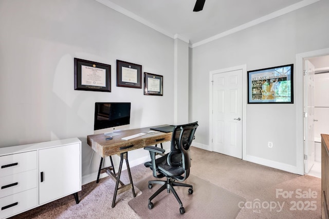 carpeted home office with ornamental molding, baseboards, and ceiling fan