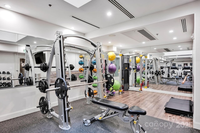 workout area with recessed lighting