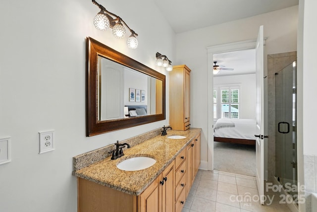 15714 Laurel Oak Cres, Davidson, NC 28036 - full bath with ensuite bathroom, double vanity, tiled shower, ceiling fan, and tile patterned floors