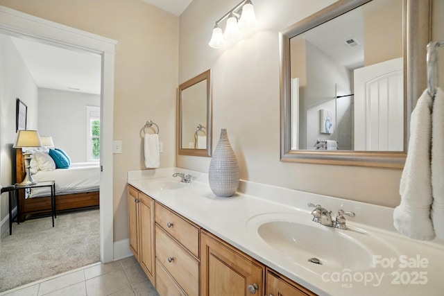 15714 Laurel Oak Cres, Davidson, NC 28036 - ensuite bathroom with double vanity, tile patterned flooring, and baseboards