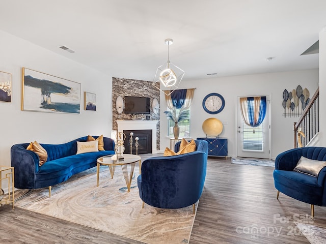6381 Trinity Crossing Cir, Kannapolis, NC 28081 - living room with wood finished floors, a large fireplace, and stairs