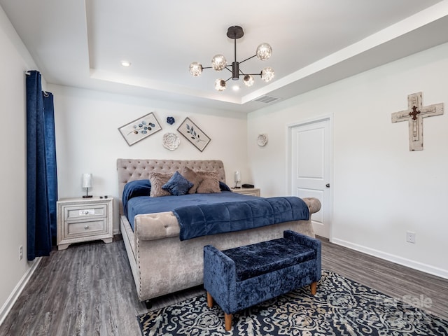 6381 Trinity Crossing Cir, Kannapolis, NC 28081 - bedroom with dark wood finished floors, baseboards, a chandelier, and a raised ceiling