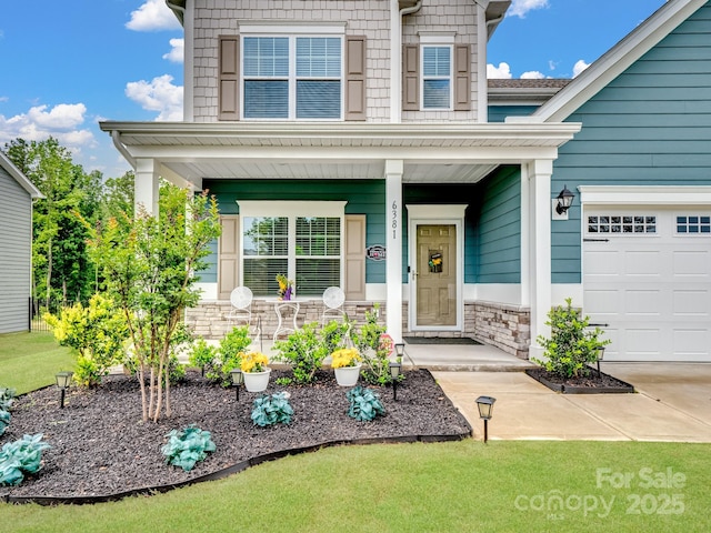 6381 Trinity Crossing Cir, Kannapolis, NC 28081 - view of front facade with a porch, stone siding, and a garage