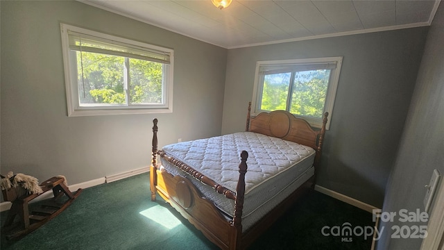 bedroom with crown molding, multiple windows, baseboards, and carpet floors