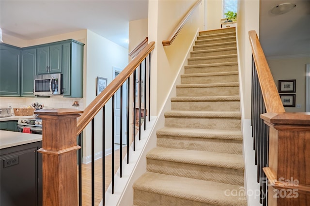 staircase with wood finished floors