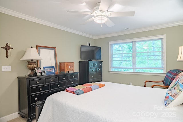 bedroom with crown molding, ceiling fan, and baseboards