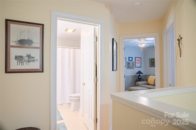 hall featuring light tile patterned floors