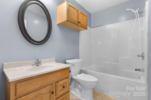 bathroom with toilet, shower / bath combination, vanity, and tile patterned flooring