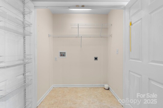 washroom with washer hookup, baseboards, and electric dryer hookup