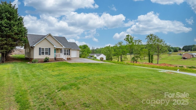 view of front of house featuring a garage, concrete driveway, and a front yard