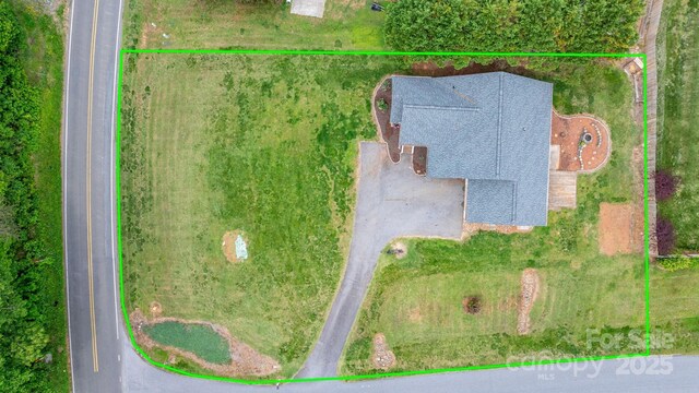 aerial view of property and surrounding area with property parcel outlined