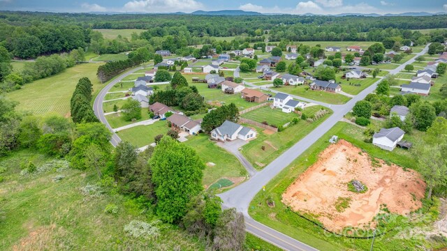 aerial view of property's location with a forest