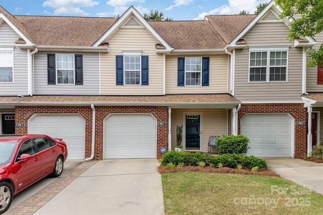 10617 Fuller Ridge Cir, Charlotte, NC 28270 - townhome / multi-family property with driveway, an attached garage, and brick siding