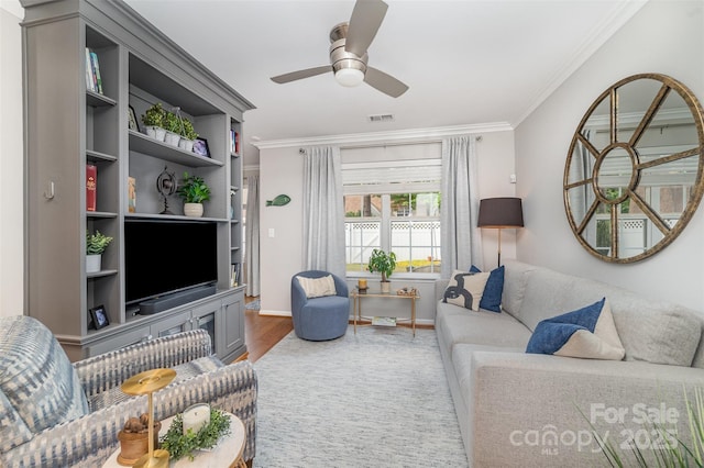 10617 Fuller Ridge Cir, Charlotte, NC 28270 - living room with crown molding, wood finished floors, a ceiling fan, and baseboards