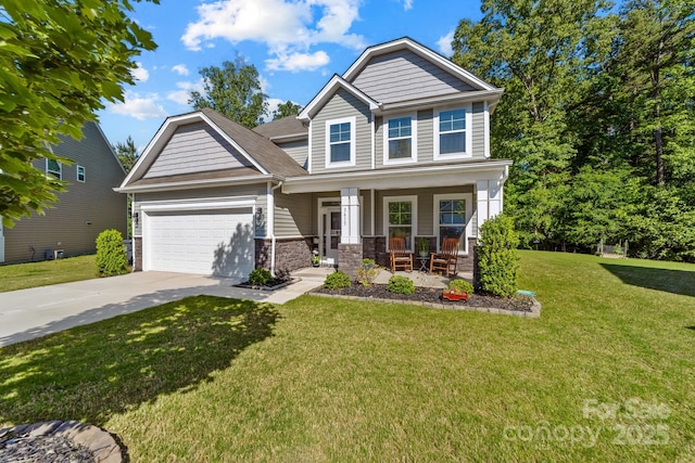 3615 Alamito Ln, Charlotte, NC 28214 - craftsman-style home with a porch, driveway, an attached garage, a front lawn, and stone siding