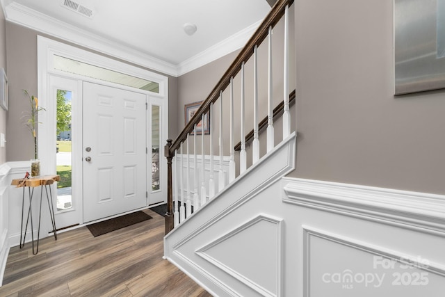 3615 Alamito Ln, Charlotte, NC 28214 - entrance foyer with wood finished floors, stairs, and crown molding