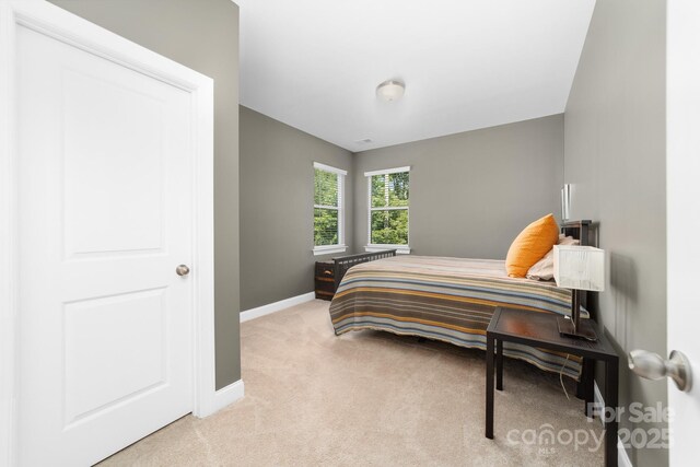 3615 Alamito Ln, Charlotte, NC 28214 - bedroom featuring light colored carpet and baseboards