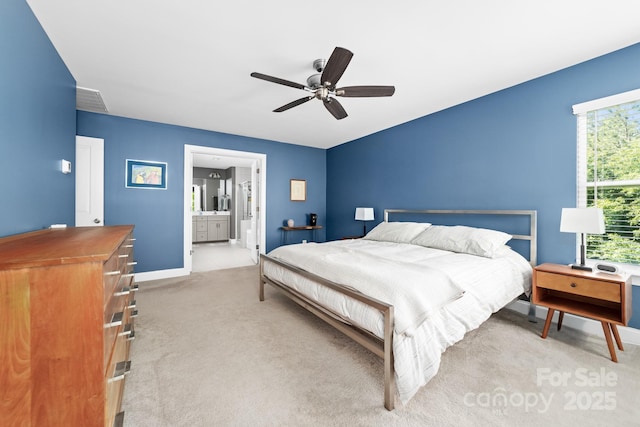 3615 Alamito Ln, Charlotte, NC 28214 - bedroom with carpet floors, baseboards, ensuite bathroom, and a ceiling fan