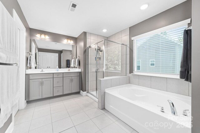 3615 Alamito Ln, Charlotte, NC 28214 - bathroom with a bath, tile patterned flooring, a stall shower, and double vanity