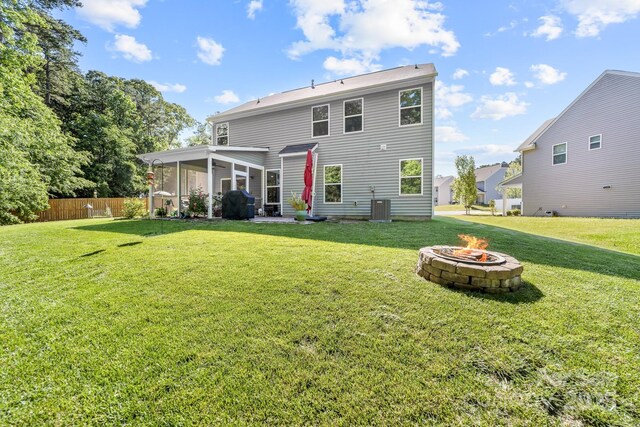 3615 Alamito Ln, Charlotte, NC 28214 - rear view of property with a sunroom, an outdoor fire pit, and central air condition unit