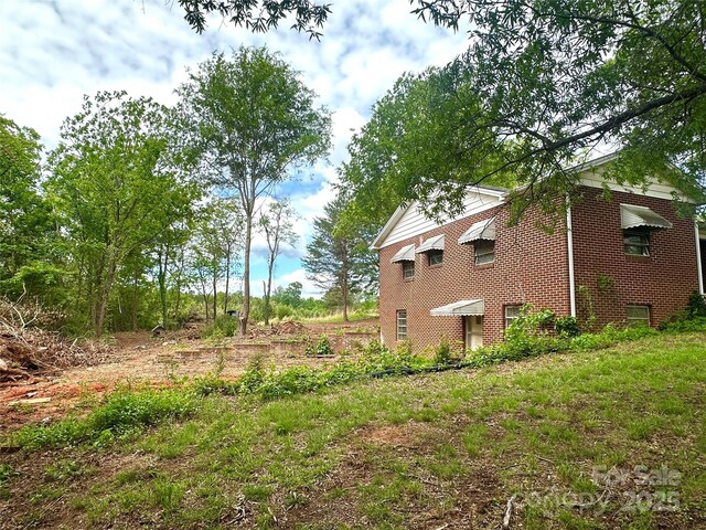view of home's exterior featuring brick siding