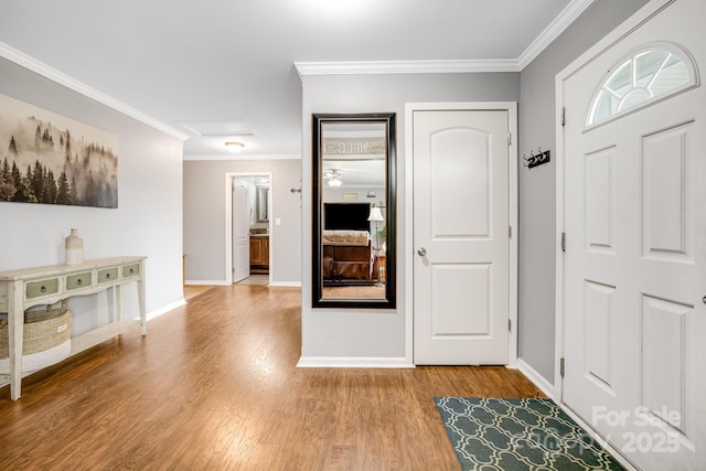 14 Phoenix Cir, Alexander, NC 28701 - foyer featuring wood finished floors, crown molding, and baseboards