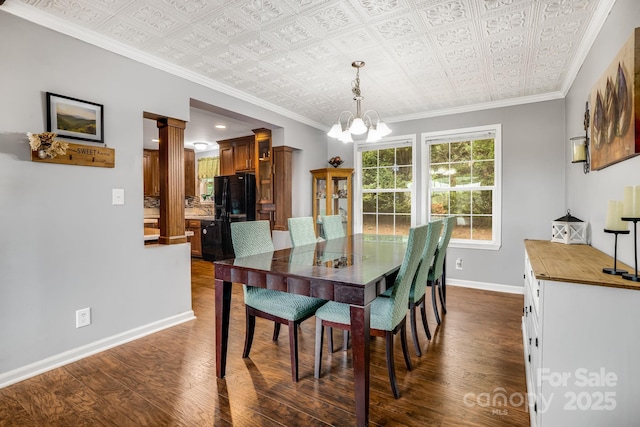 14 Phoenix Cir, Alexander, NC 28701 - dining room featuring an ornate ceiling, dark wood-type flooring, baseboards, a chandelier, and crown molding