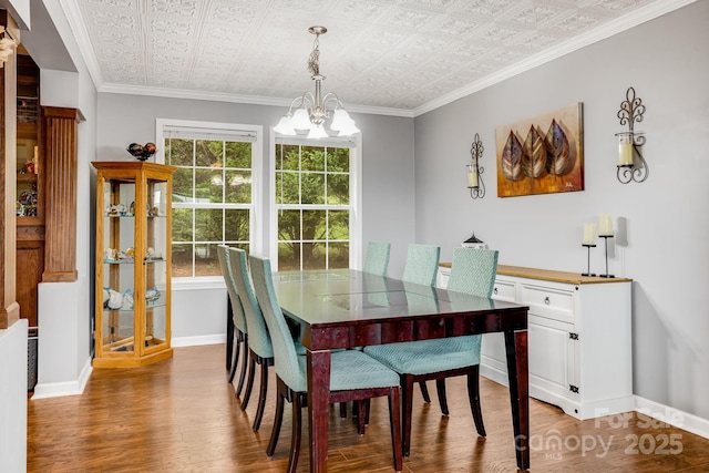 14 Phoenix Cir, Alexander, NC 28701 - dining area with a chandelier, an ornate ceiling, wood finished floors, baseboards, and crown molding