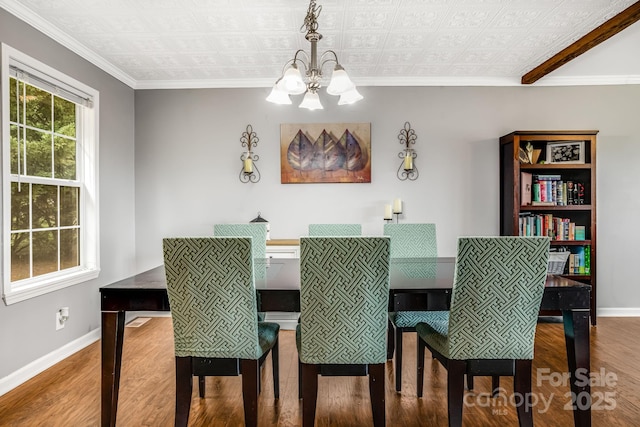 14 Phoenix Cir, Alexander, NC 28701 - dining space featuring a chandelier, wood finished floors, baseboards, an ornate ceiling, and ornamental molding