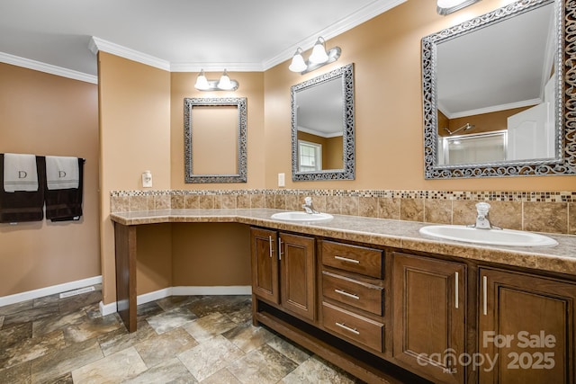 14 Phoenix Cir, Alexander, NC 28701 - full bathroom featuring baseboards, crown molding, stone finish flooring, double vanity, and a shower with door