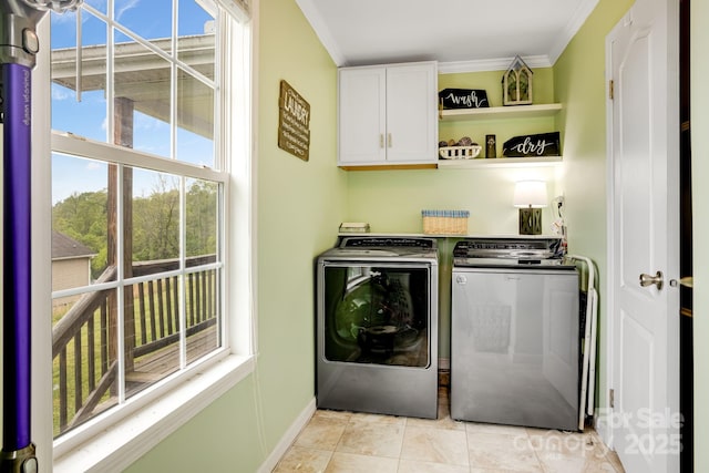 14 Phoenix Cir, Alexander, NC 28701 - laundry area featuring cabinet space, washer and dryer, ornamental molding, and light tile patterned floors