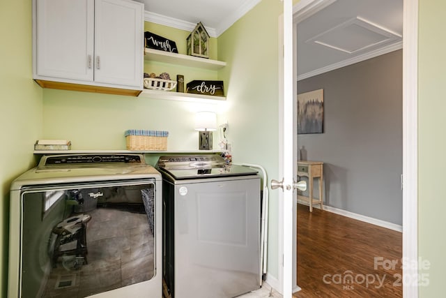 14 Phoenix Cir, Alexander, NC 28701 - washroom featuring cabinet space, ornamental molding, washing machine and clothes dryer, attic access, and wood finished floors