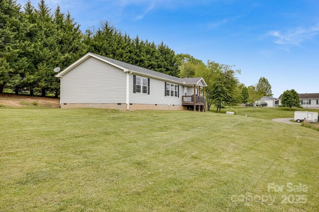 14 Phoenix Cir, Alexander, NC 28701 - back of property with crawl space, a lawn, a wooden deck, and roof with shingles