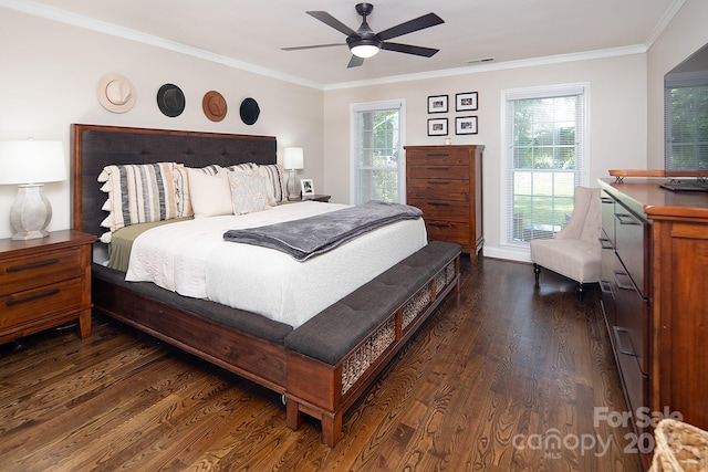 bedroom with dark wood-style floors, ornamental molding, and ceiling fan