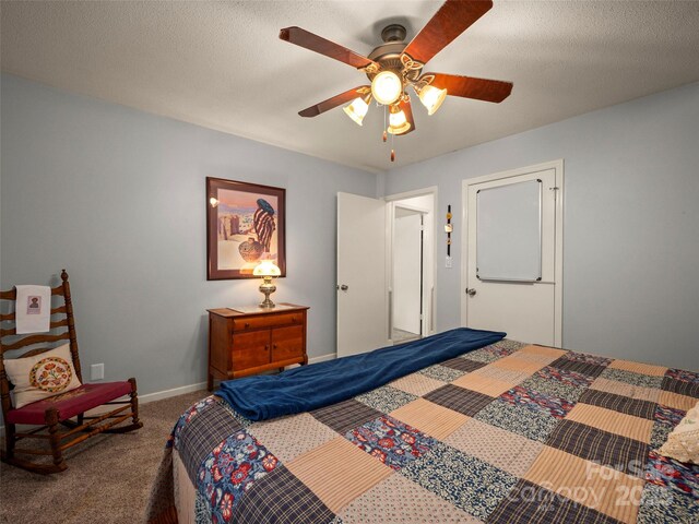 carpeted bedroom with ceiling fan and baseboards