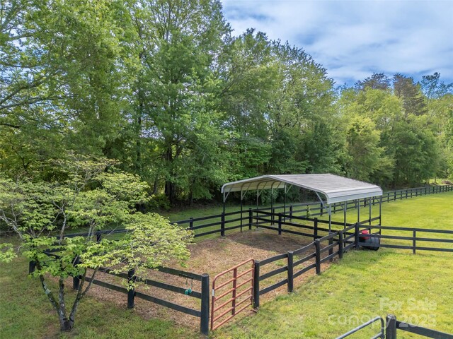 view of property's community featuring a carport and a view of countryside