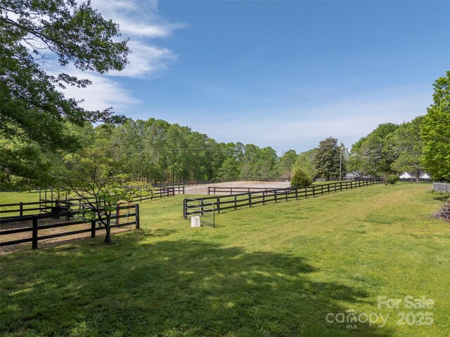 view of yard with a rural view