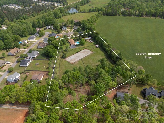 aerial perspective of suburban area featuring property boundaries highlighted