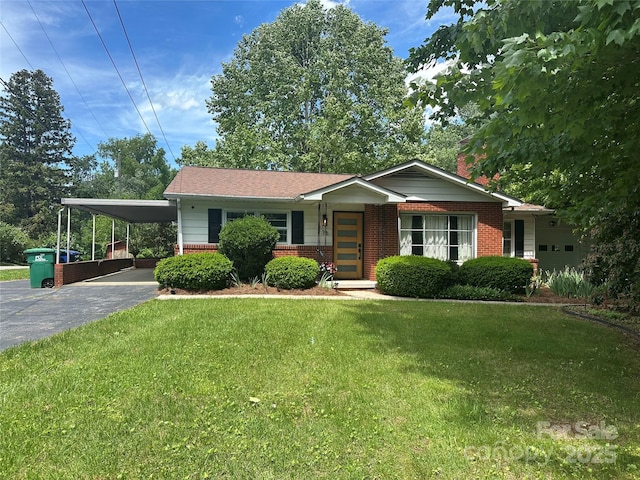 76 W Oakview Rd, Asheville, NC 28806 - single story home with brick siding, asphalt driveway, a front lawn, and a carport