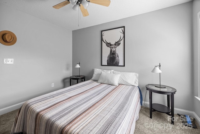 carpeted bedroom with baseboards, a textured ceiling, and a ceiling fan
