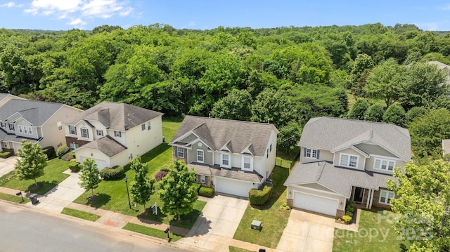 aerial view of residential area with a forest
