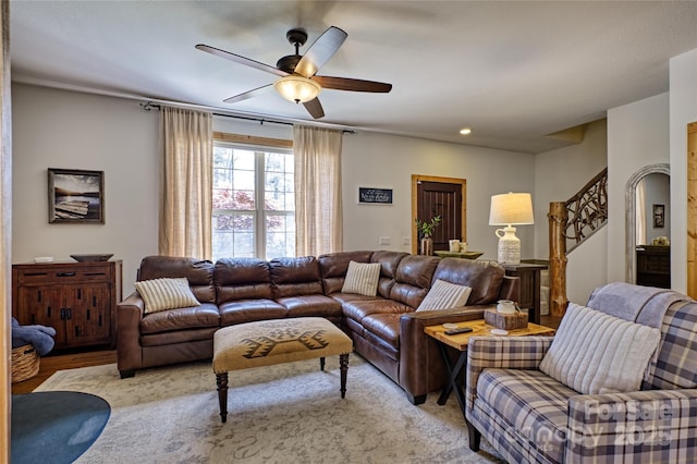 living area with a ceiling fan, stairs, and recessed lighting