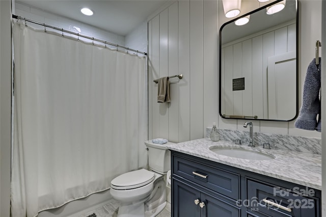 full bathroom with toilet, vanity, and shower / tub combo with curtain