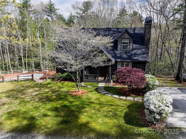 new england style home with a chimney
