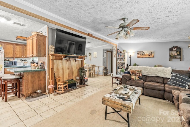 4155 Slanting Bridge Rd, Sherrills Ford, NC 28673 - living room featuring light tile patterned flooring, a textured ceiling, ceiling fan, and crown molding